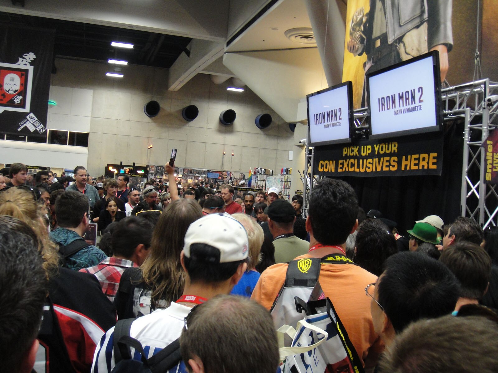 A collectibles booth on a busy convention floor.